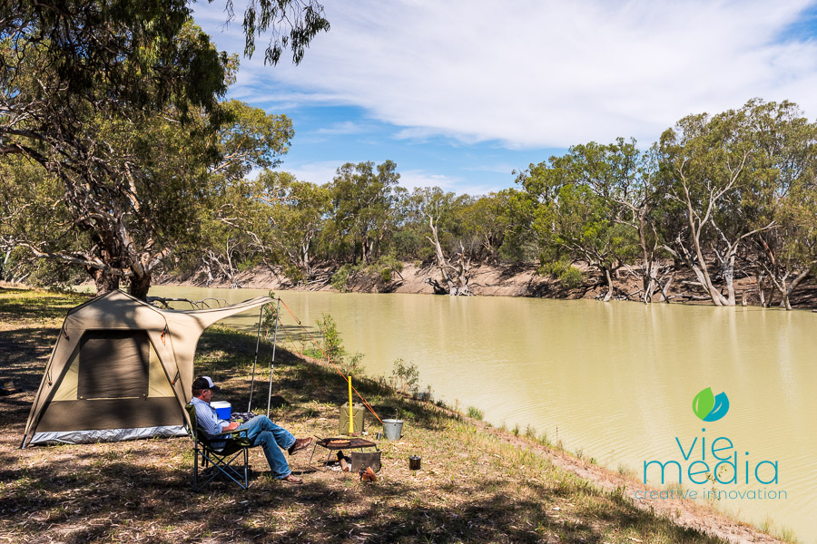Simon Bayliss camping on the banks of the Darling River at Nelia Gaari Station, Outback NSW, Australia