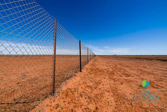 Reaching the survey marker of NSW, QLD, and SA is a highlight of driving along the Dingo Fence from Broken Hill to Cameron Corner, Outback NSW, Australia.